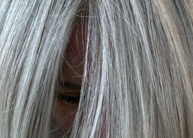 Close-up of silver hair styled at Rosie Baylis Hair, Tunbridge Wells, England, GB.