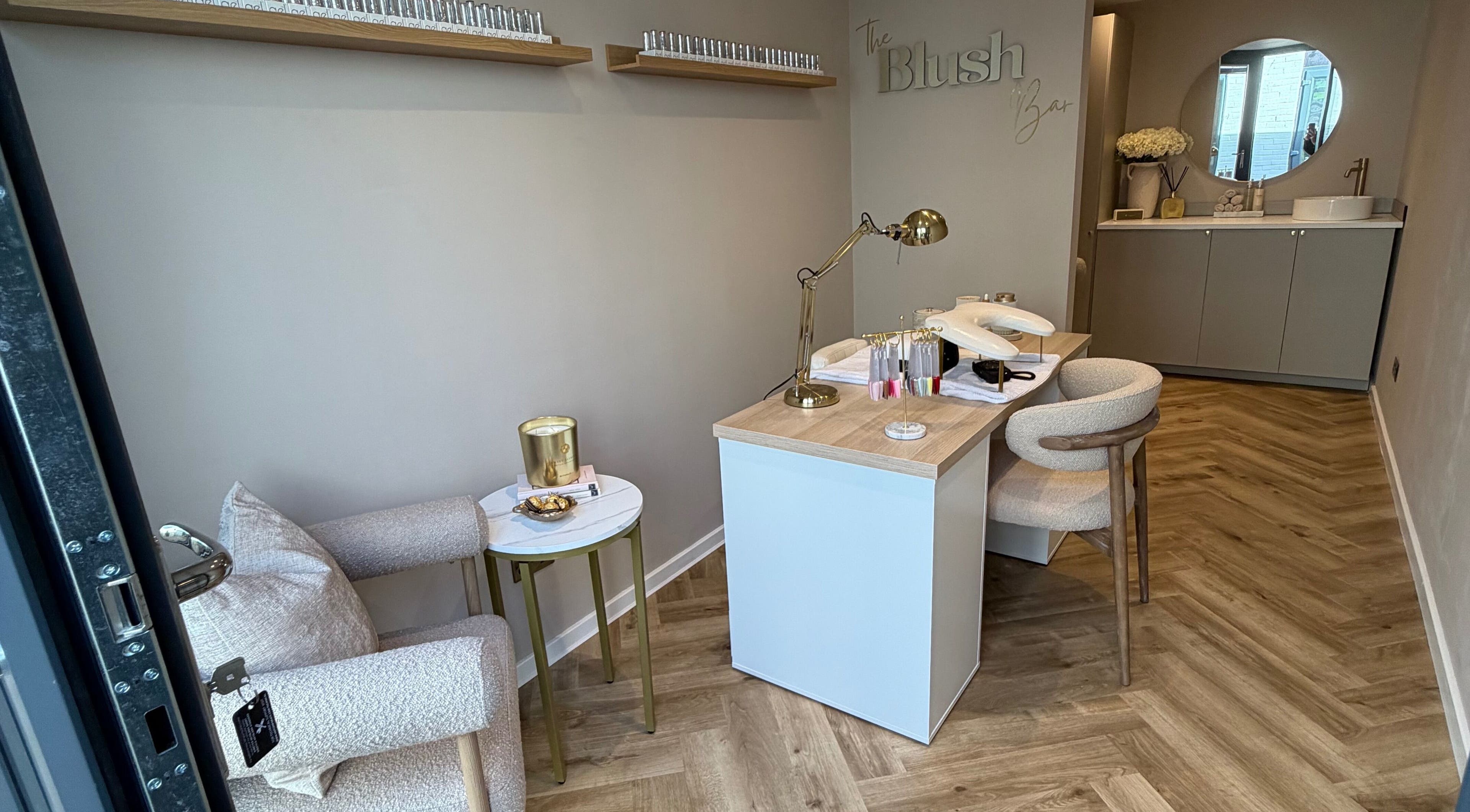 Reception area at The Blush Bar, Killingworth, England, GB with elegant decor and cozy seating.