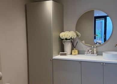Elegant vanity area at The Blush Bar, Killingworth, England, GB with round mirror and chic decor.