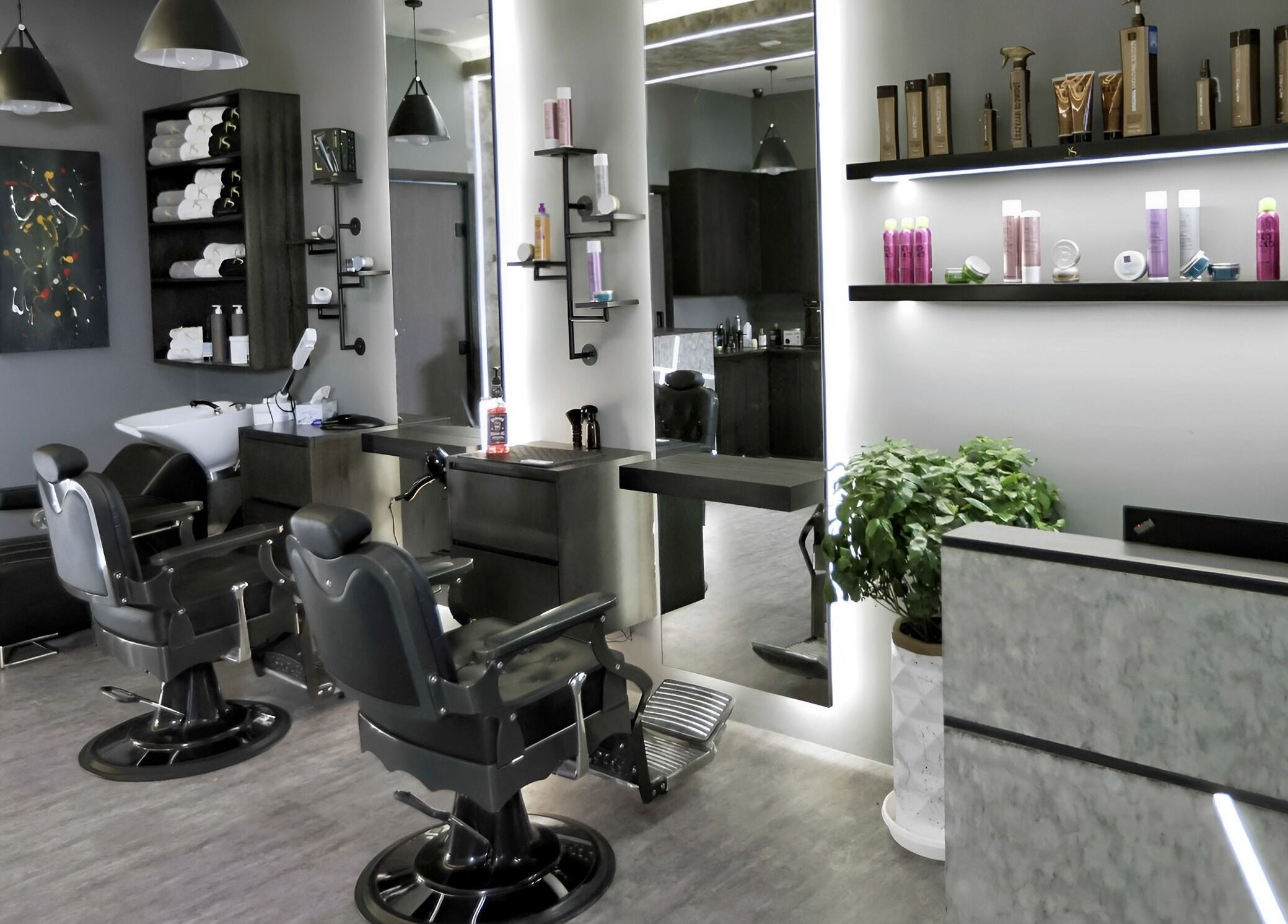 Modern interior of Khoodi Style Gents Salon in Dubai, Dubai, AE, featuring sleek styling stations and premium products.