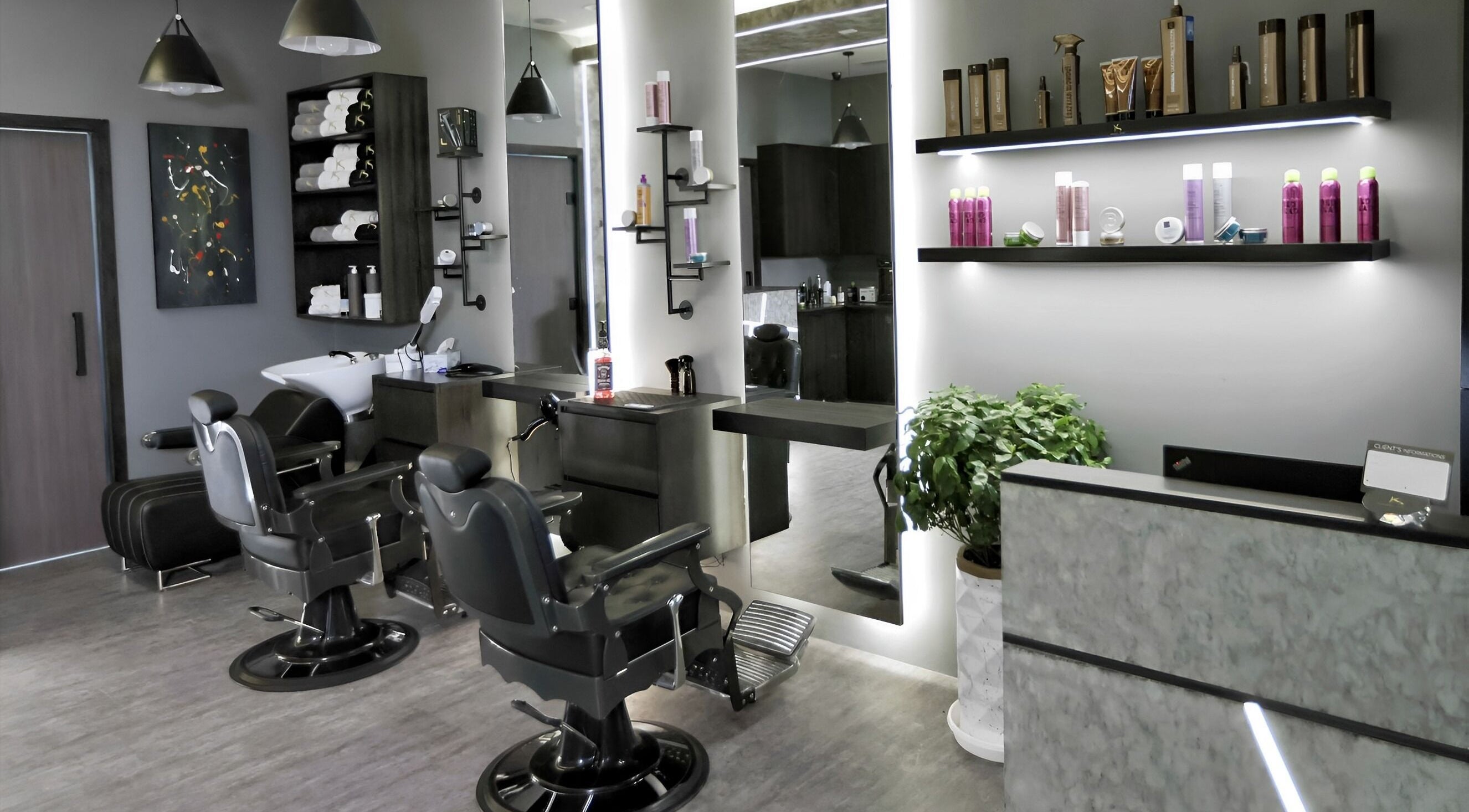 Modern interior of Khoodi Style Gents Salon in Dubai, Dubai, AE, featuring sleek styling stations and premium products.