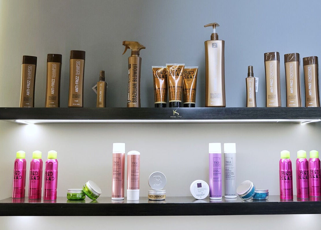 Hair care products displayed at Khoodi Style Gents Salon, Dubai, Dubai, AE, showcasing diverse styling options.