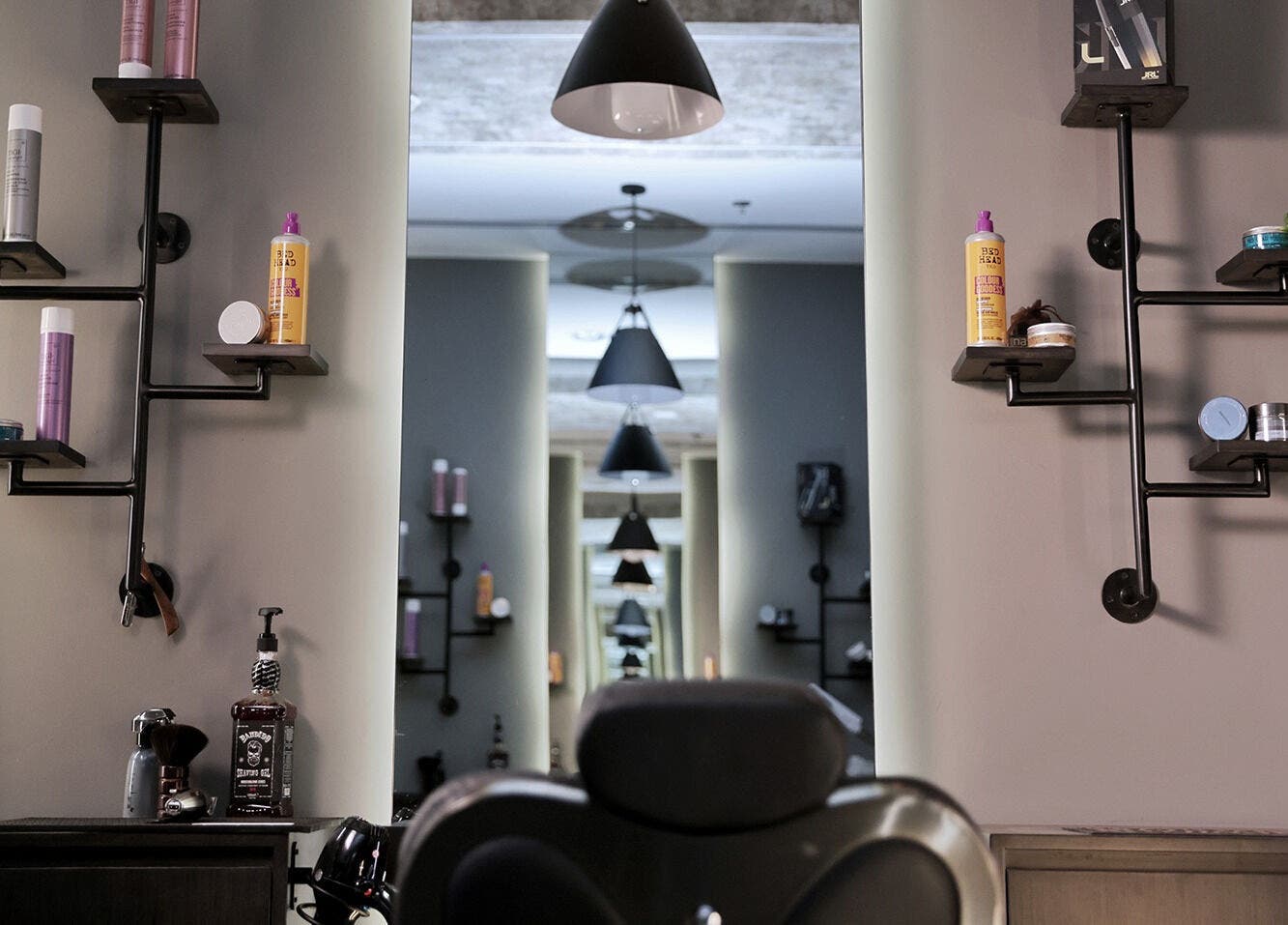 Sophisticated salon interior with shelves at Khoodi Style Gents Salon, Dubai, Dubai, AE.
