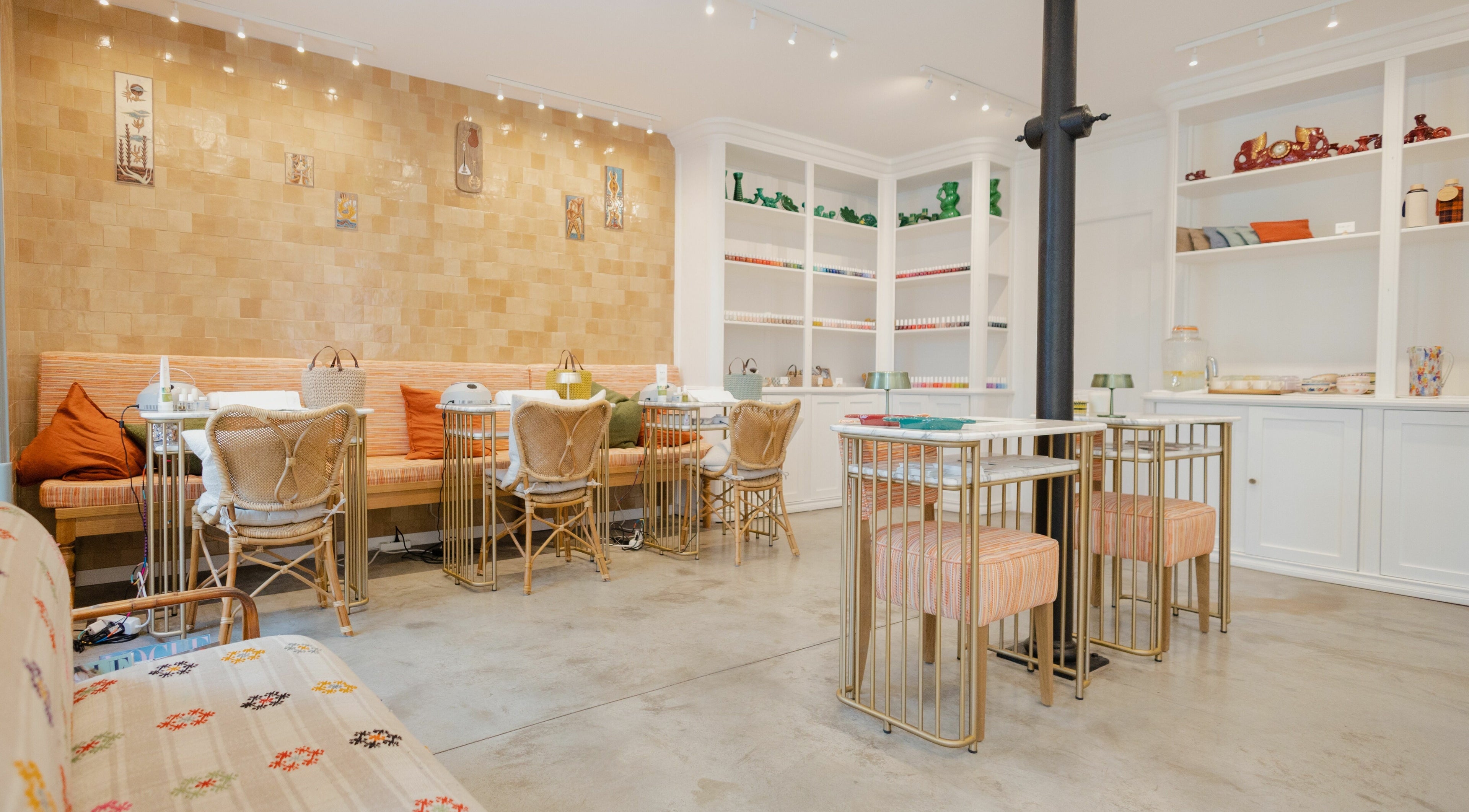Elegant interior of Nail Club in Lisboa, Lisboa, PT featuring stylish chairs and nail polish display.