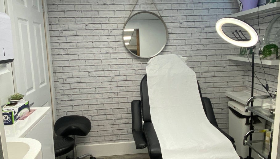 Elegant treatment room at NS Skin Clinic, Hazel Grove, England, GB with a modern chair and serene decor.