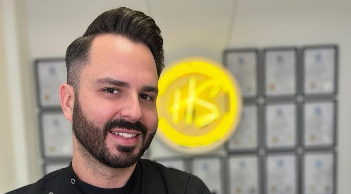 Friendly stylist at Haus of Slay, Dublin, County Dublin, IE, showcasing expert grooming skills.