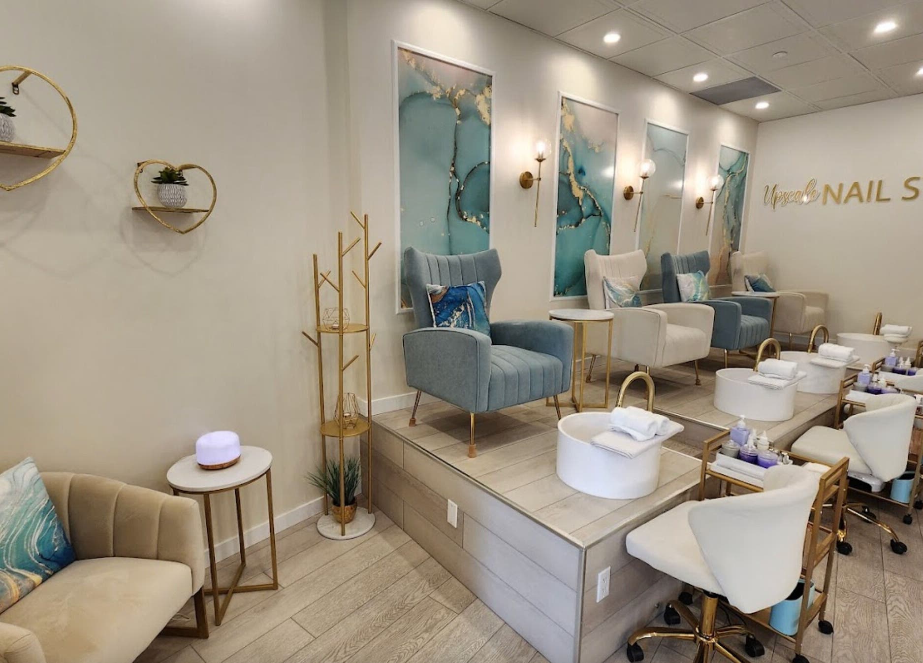 Elegant interior of Upscale Nail Studio in Vancouver, British Columbia, CA, featuring plush chairs and nail stations.