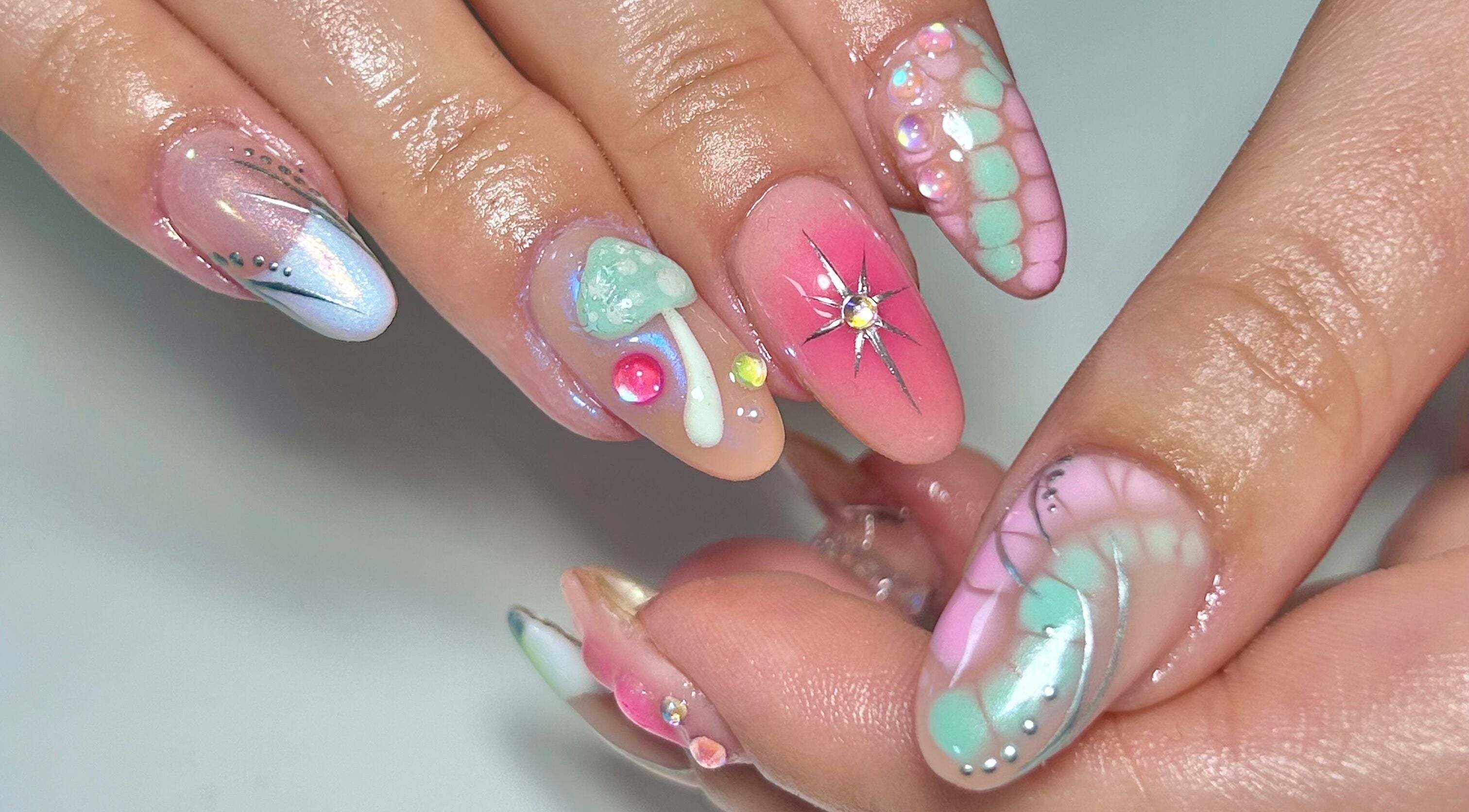 Vibrant, artistic nail design at Jade Saunders Nails, Rugby, England, GB features colorful patterns and embellishments.