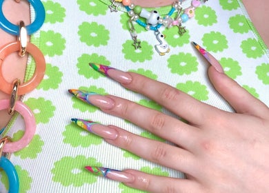 Colorful nail art at Jade Saunders Nails, Rugby, England, GB, featuring vibrant floral and geometric designs.