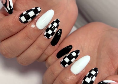 Stylish black and white checkered nail art at Jade Saunders Nails, Rugby, England, GB.