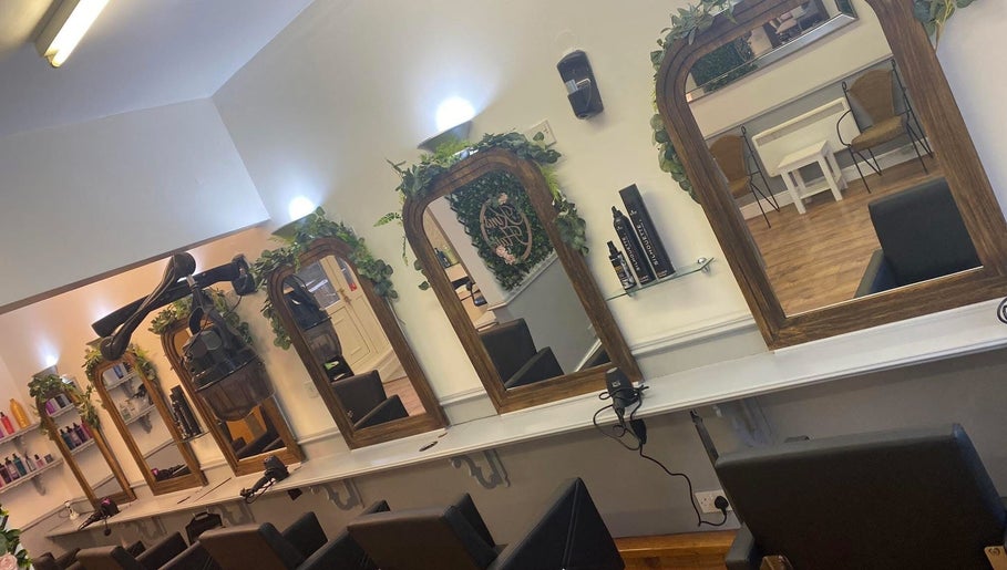 Elegant salon mirrors at Kims Hair in Ferryhill, England, GB, showcasing professional styling stations.