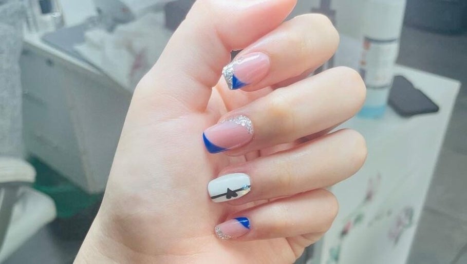 Stylish blue and silver nail art at Black and Purple Pride of Royalty at Hair Design Salon, Roodepoort, Gauteng, ZA.