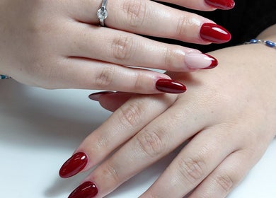 Elegant red manicure at Black and Purple Pride of Royalty at Hair Design Salon, Roodepoort, Gauteng, ZA.