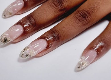 Elegant nail art with gold accents at Black and Purple Pride of Royalty at Hair Design Salon, Roodepoort, Gauteng, ZA.