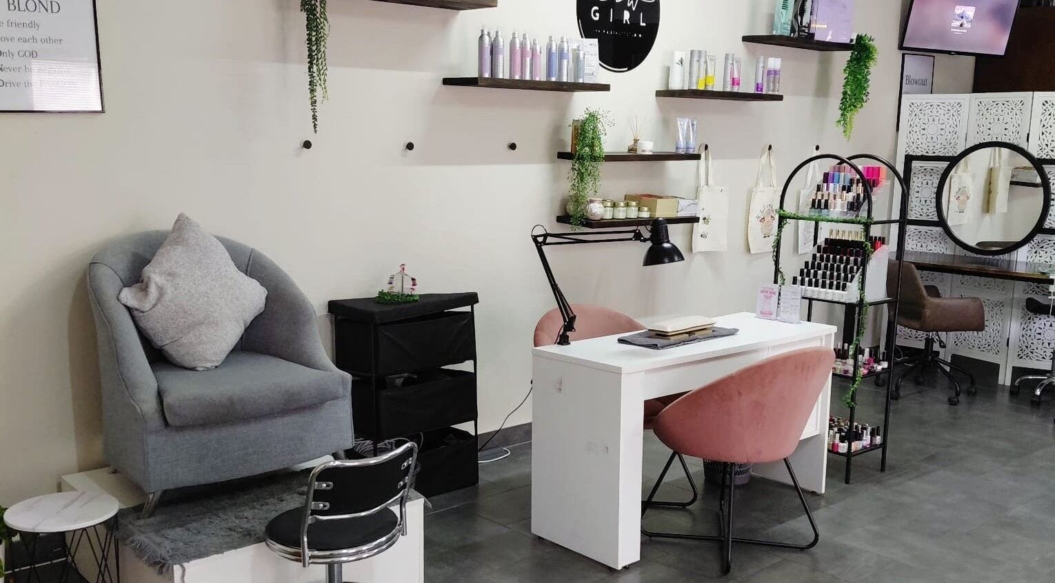 Stylish interior of Black & Purple Beauty Spa - Nails By Dee in Roodepoort, Gauteng, ZA, featuring manicure station.