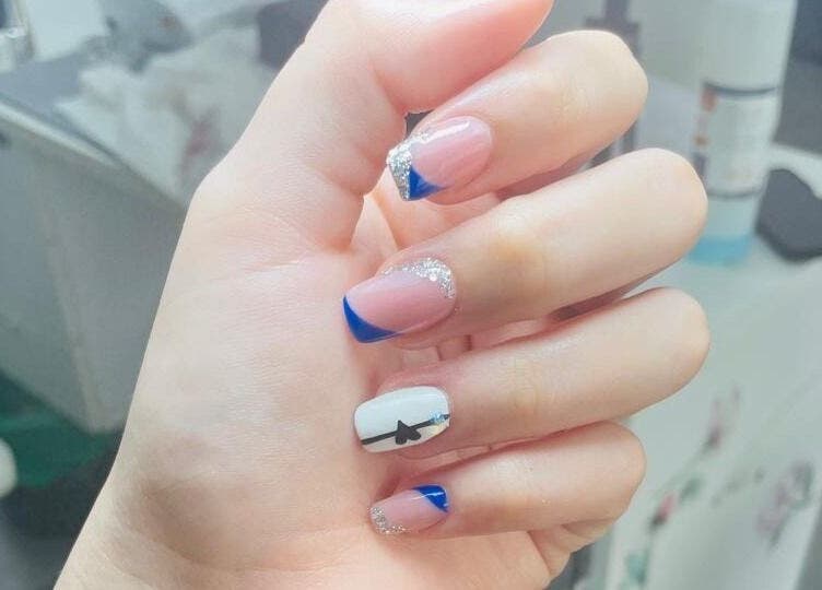Elegant blue-tipped nails with art by Nails By Dee at Black & Purple Beauty Spa, Roodepoort, Gauteng, ZA.