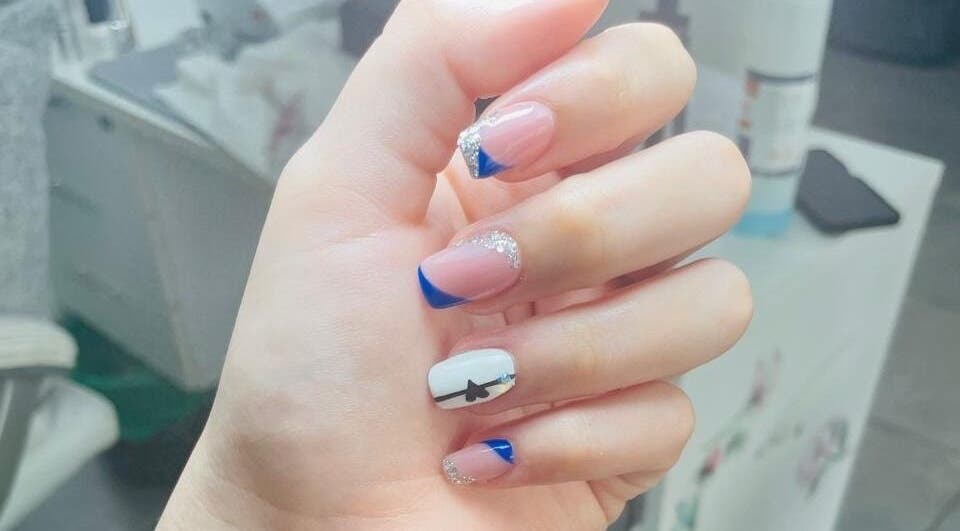 Elegant blue-tipped nails with art by Nails By Dee at Black & Purple Beauty Spa, Roodepoort, Gauteng, ZA.