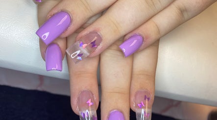 Lavender and butterfly nail art at Nail Nook, Bingley, England, GB, showcasing stylish manicure design.