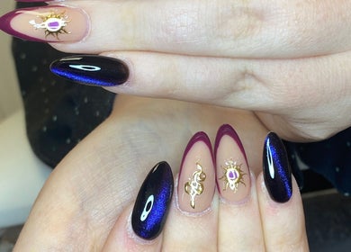 Stunning nail art with gold accents at Nail Nook, Bingley, England, GB.