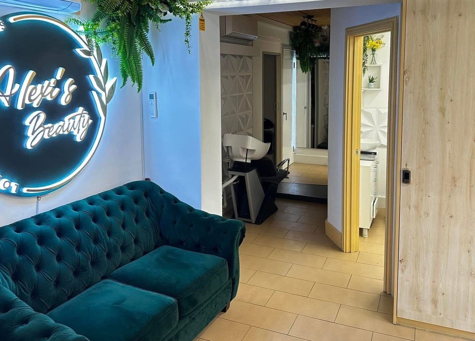 Cozy lounge at ABeauty's, Alexis in London, England, GB featuring chic decor and lush seating.