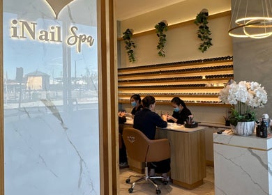 Inside iNail Spa in Mentone, Victoria, AU with clients receiving manicures in a calm setting.