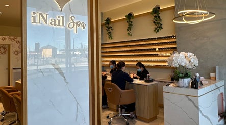 Inside iNail Spa in Mentone, Victoria, AU with clients receiving manicures in a calm setting.