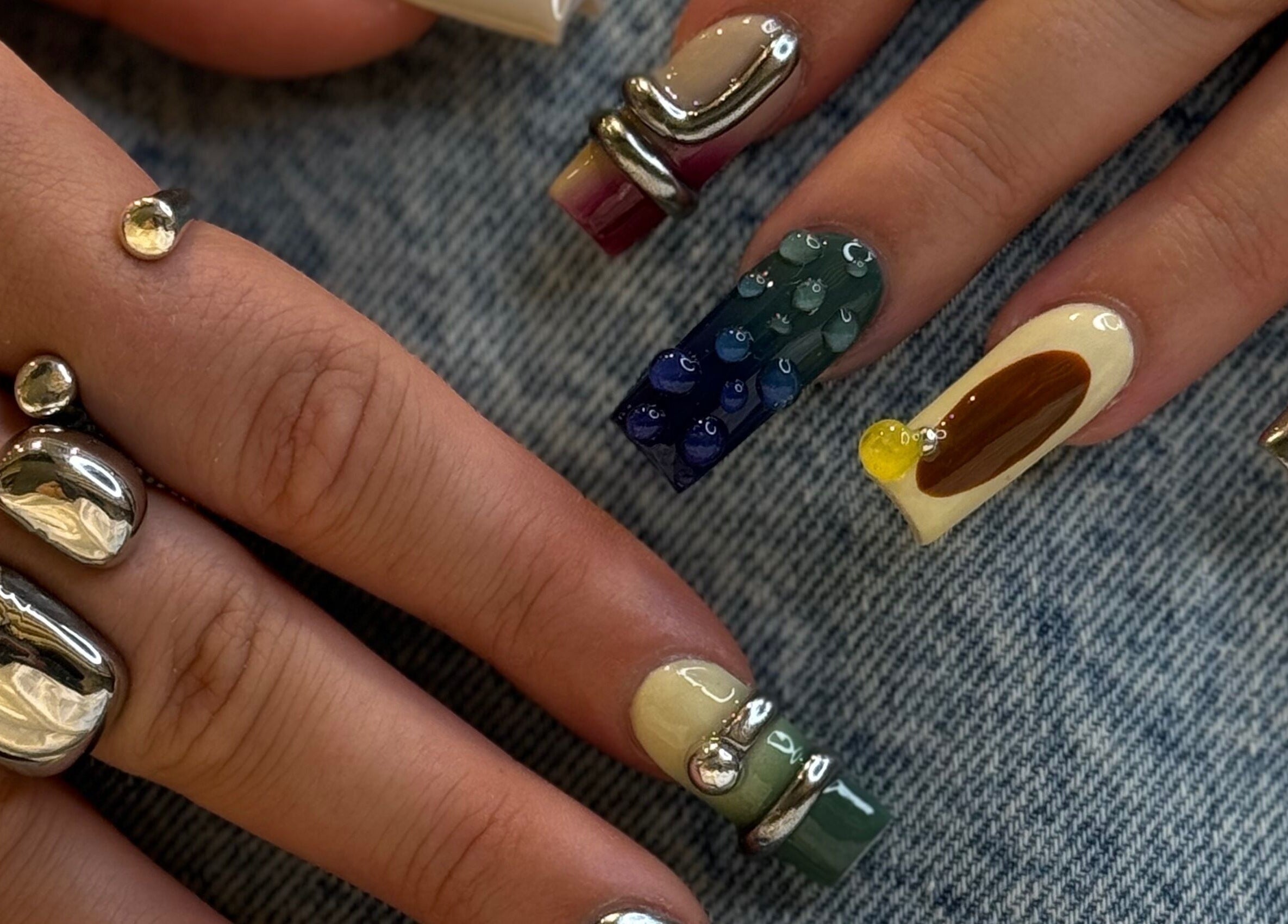 Intricate metallic and patterned nail art at iNail Spa, Mentone, Victoria, AU.