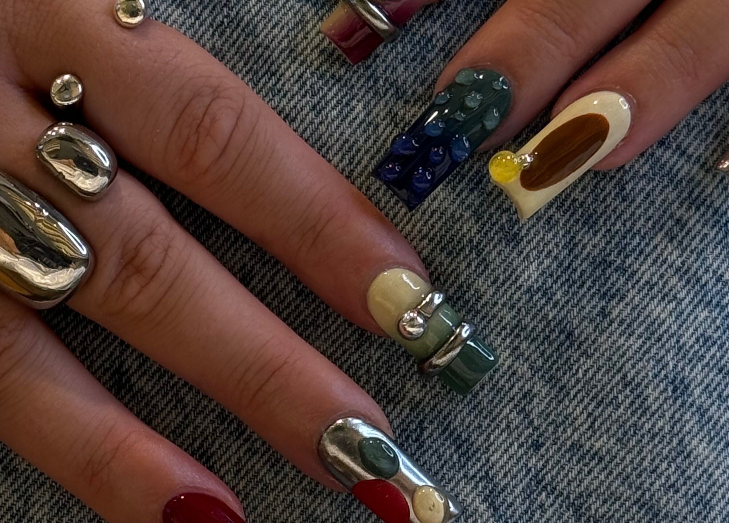 Unique nail art design at iNail Spa, Mentone, Victoria, AU, showcasing creative and colorful patterns.