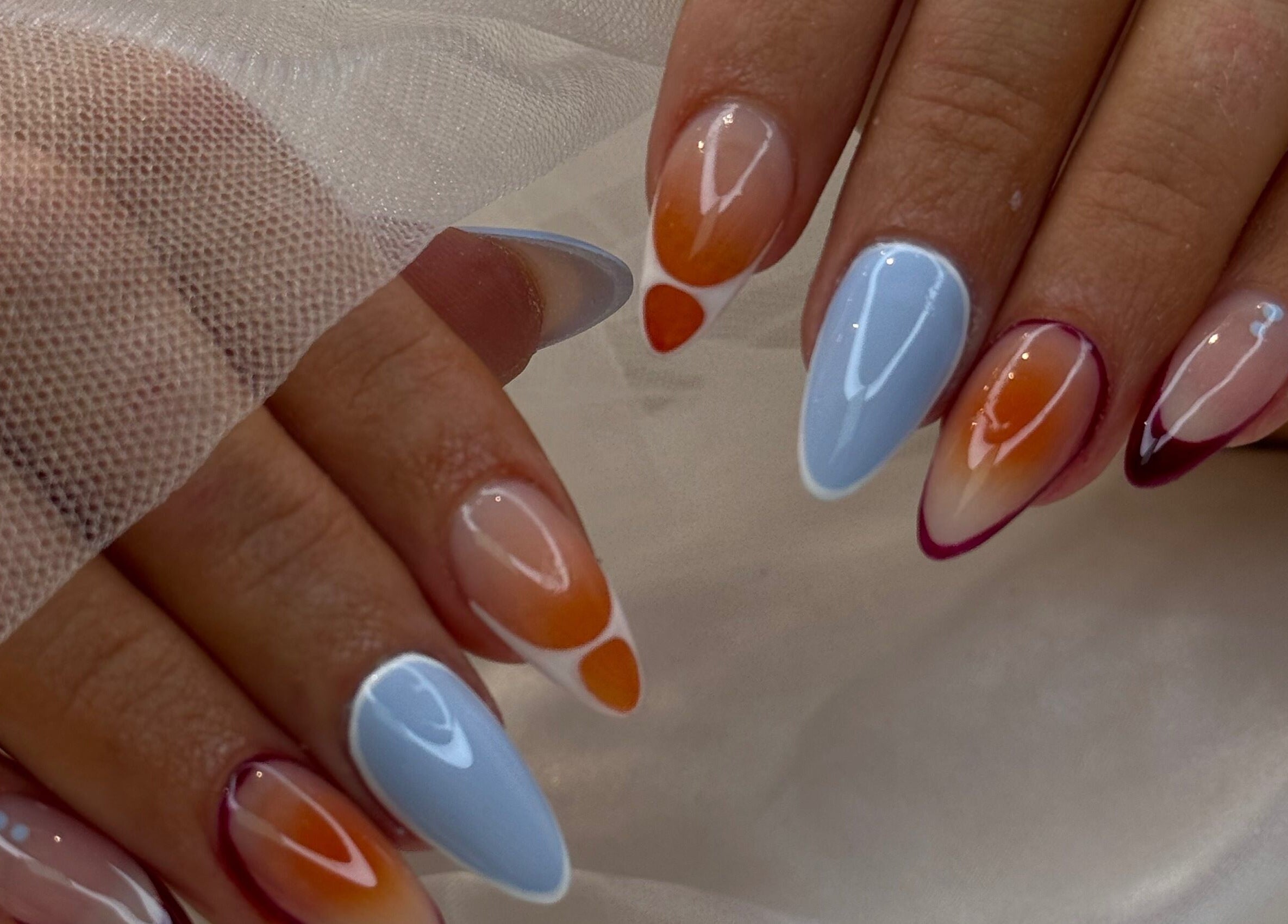 Colorful nail art at iNail Spa, Mentone, Victoria, AU, showcasing intricate manicure designs.