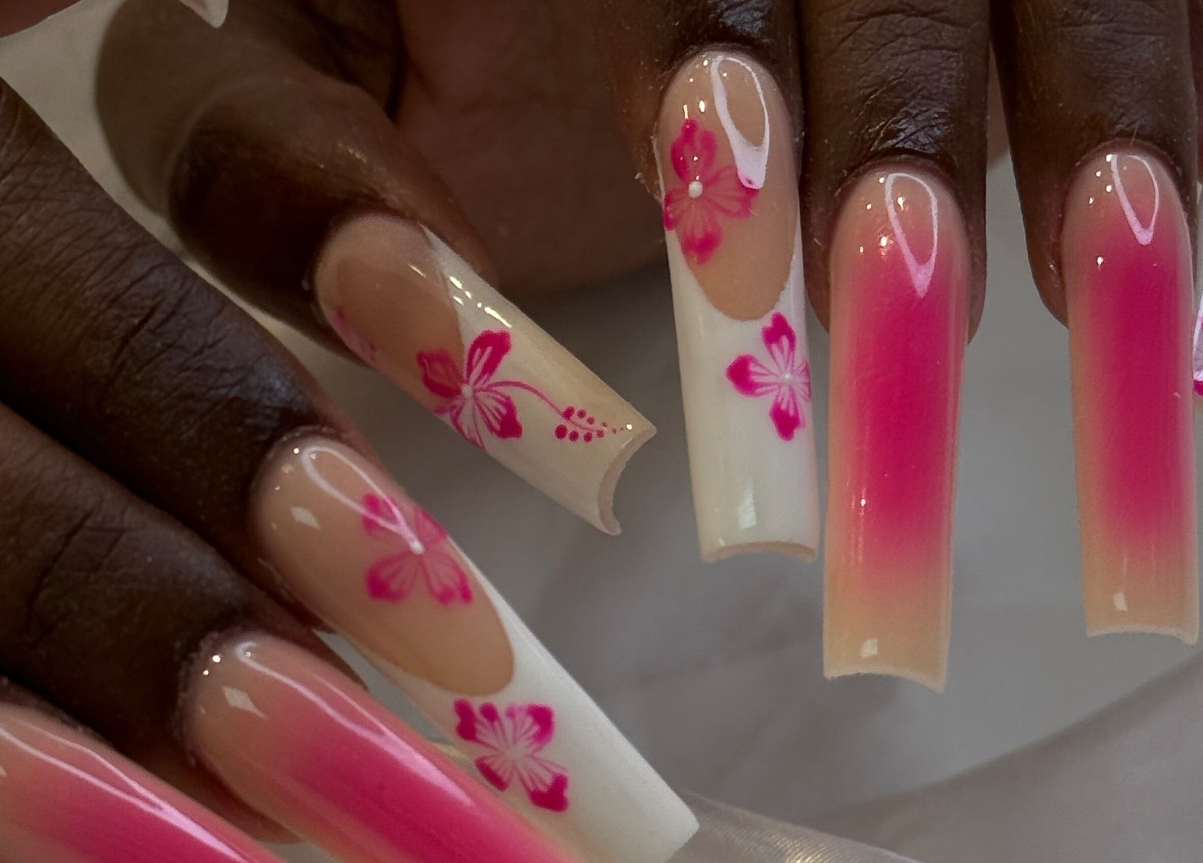 Elegant pink floral nail design at iNail Spa, Mentone, Victoria, AU, highlighting luxurious beauty.