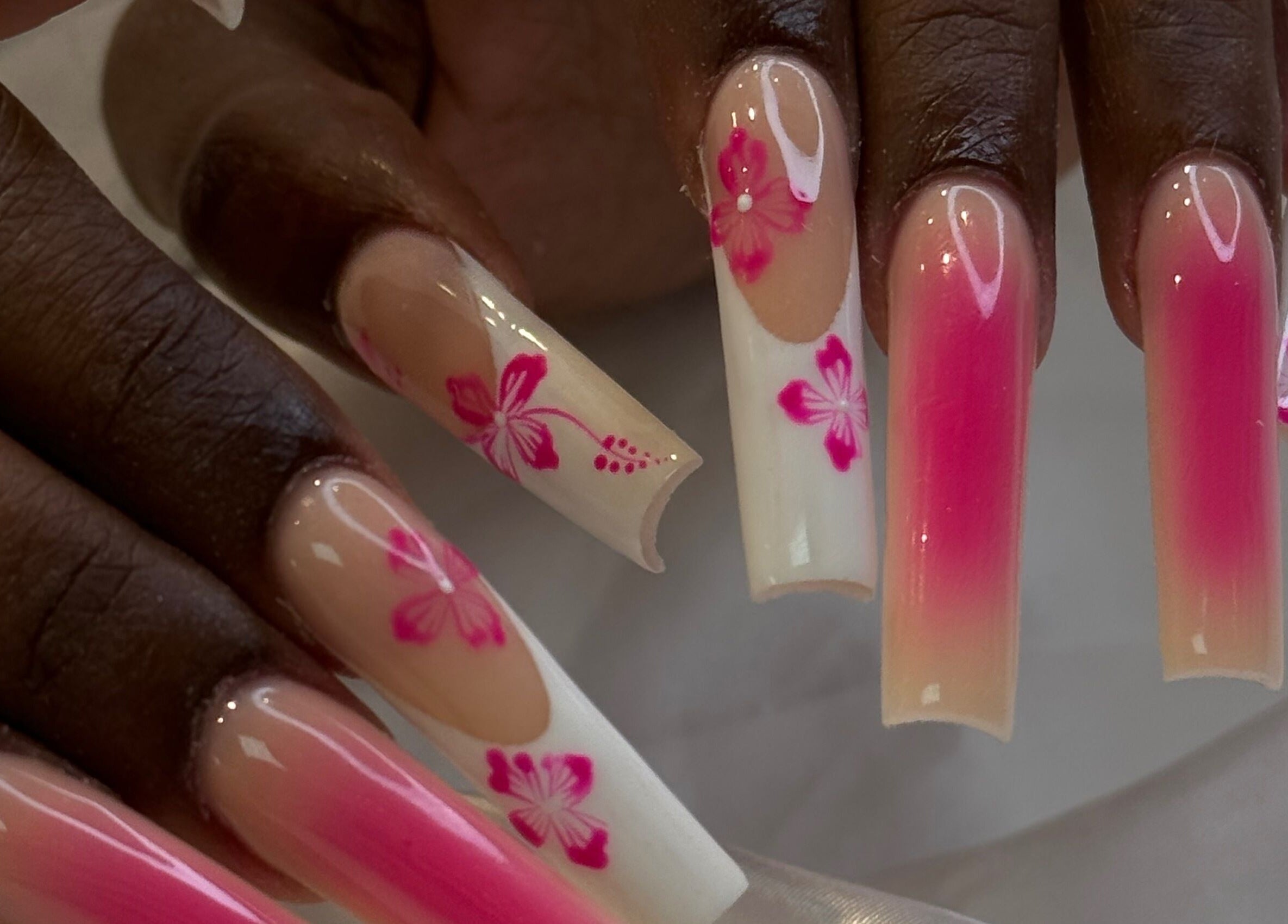 Elegant pink floral nail design at iNail Spa, Mentone, Victoria, AU, highlighting luxurious beauty.