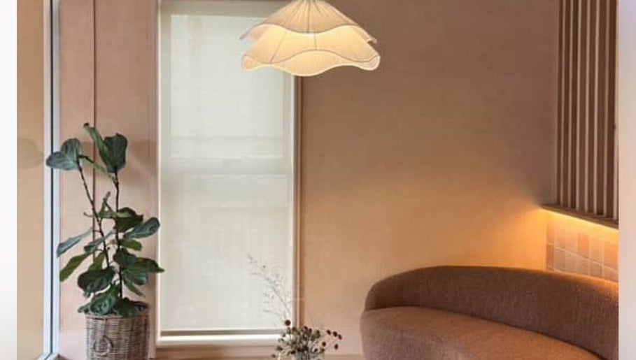 Elegant lounge with plant at House of Terri Brows, Rozelle, New South Wales, AU. Inviting and stylish decor.