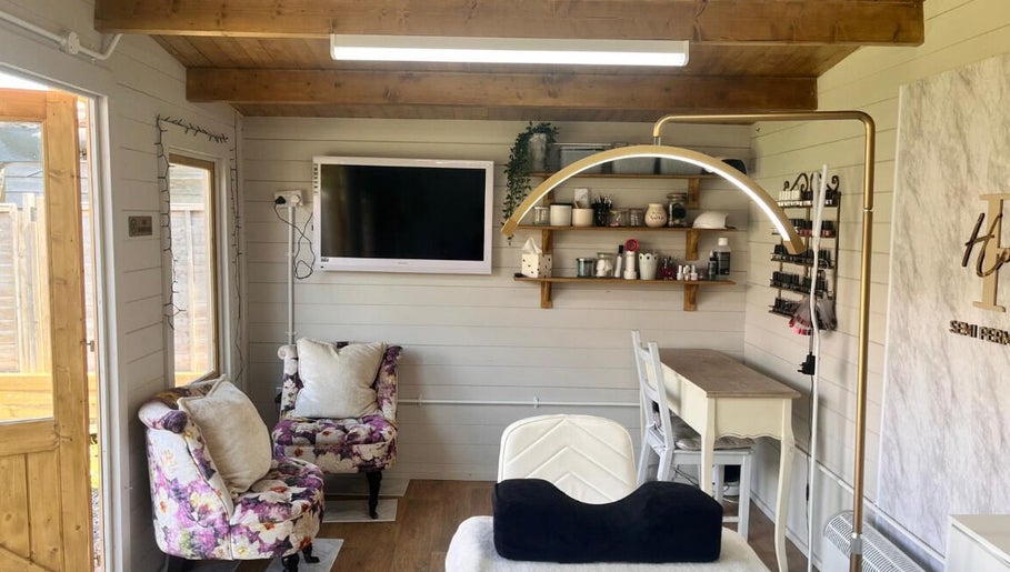 Charming interior of Holly Wood semi permanent make up & beauty in Chichester, England, GB with floral decor.