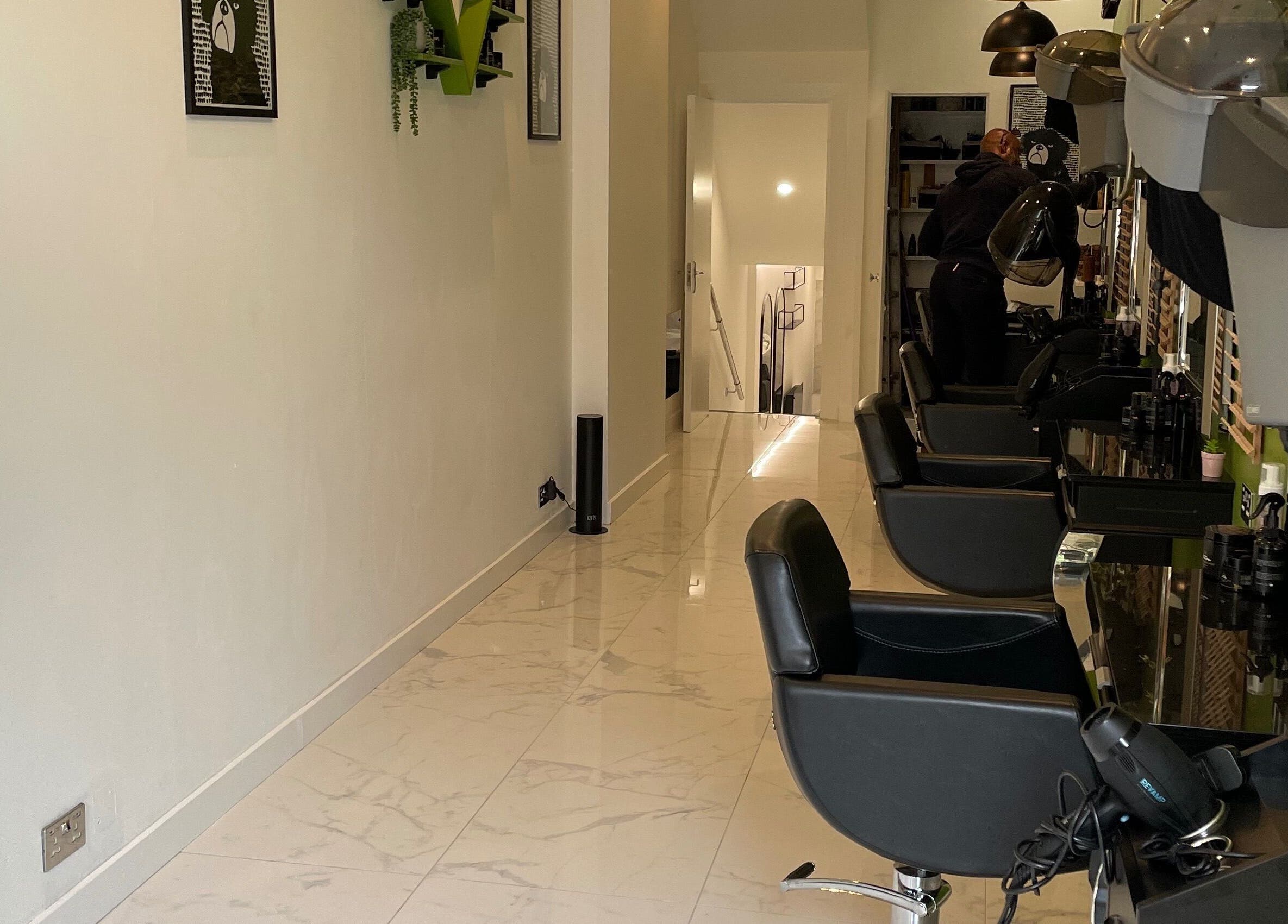 Chic interior of The Braiding Vault Uk in London, England, GB with stylish salon chairs and decor.