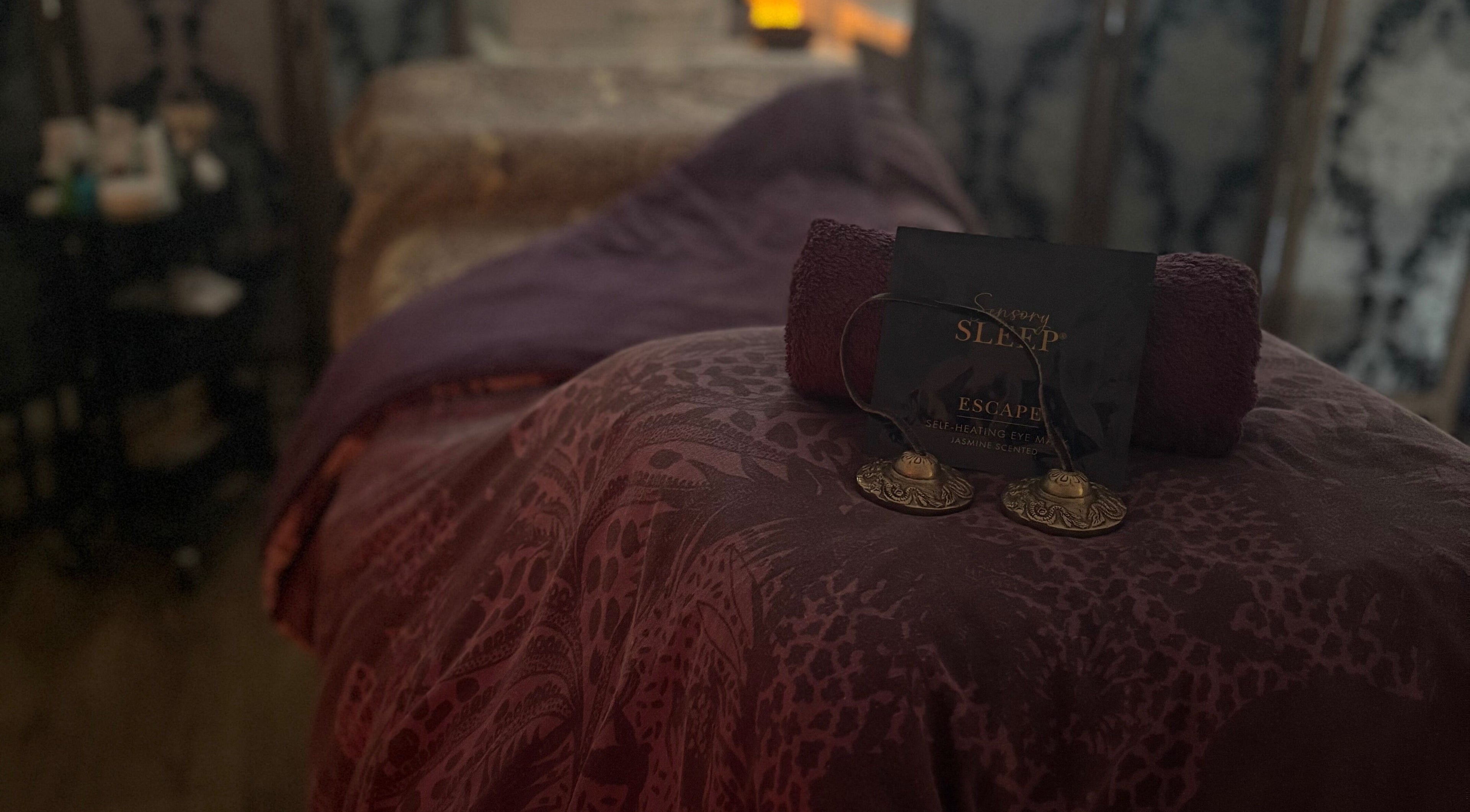 Relaxing spa setup at Tranquility Holistic, Sarisbury Green, England, GB, with purple linens and calming decor.