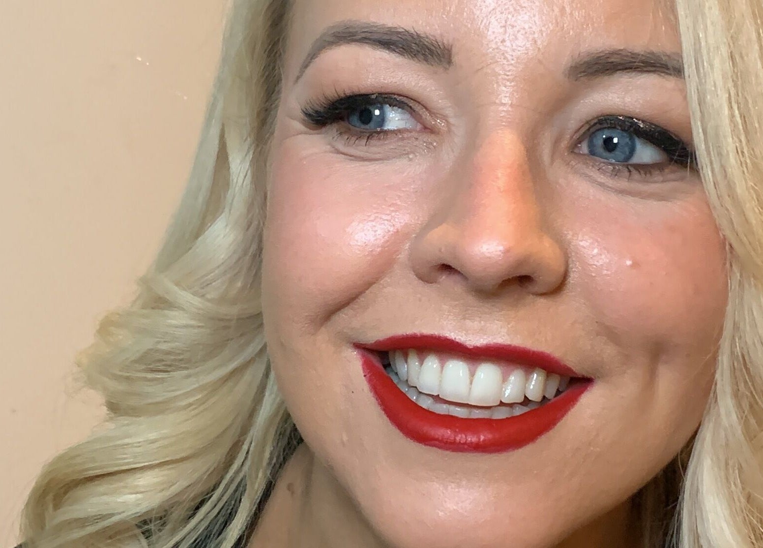 A woman with elegant makeup and red lipstick by Ruth Killen Make Up in Dunboyne, County Meath, IE.