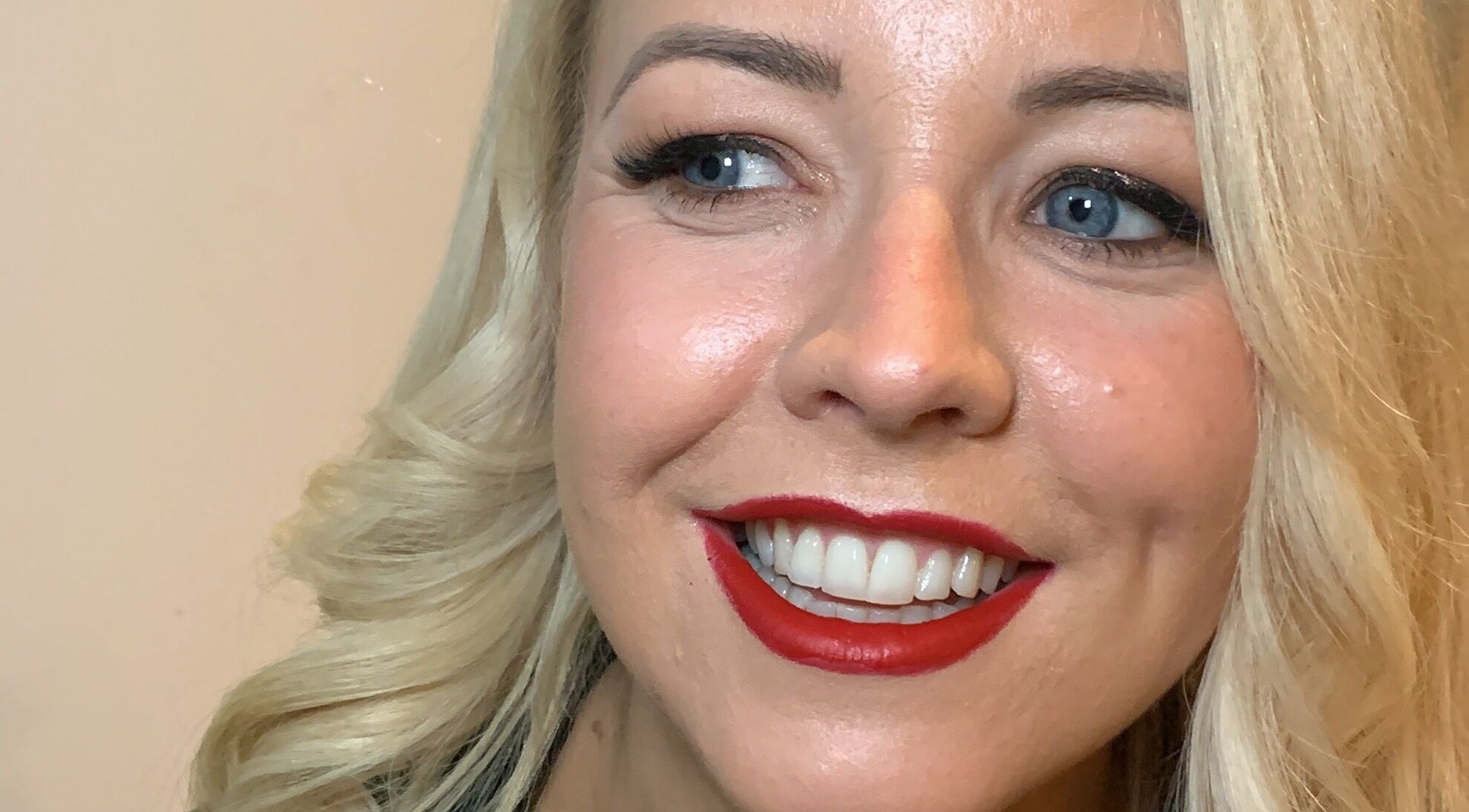 A woman with elegant makeup and red lipstick by Ruth Killen Make Up in Dunboyne, County Meath, IE.