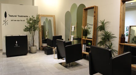 Relaxing interior of Hair Corner Salon in Dubai, Dubai, AE, featuring chic chairs and lush greenery.