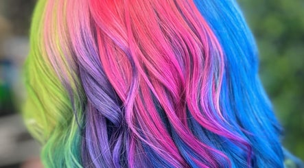 Vibrant rainbow hair at Red's Hairdressing, Swindon, England, GB, showcasing expert coloring techniques.