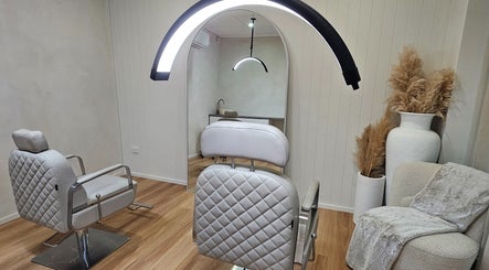 Elegant salon chair at Studio SMP Gold Coast in Bundall, Queensland, AU with cozy decor and modern lighting.