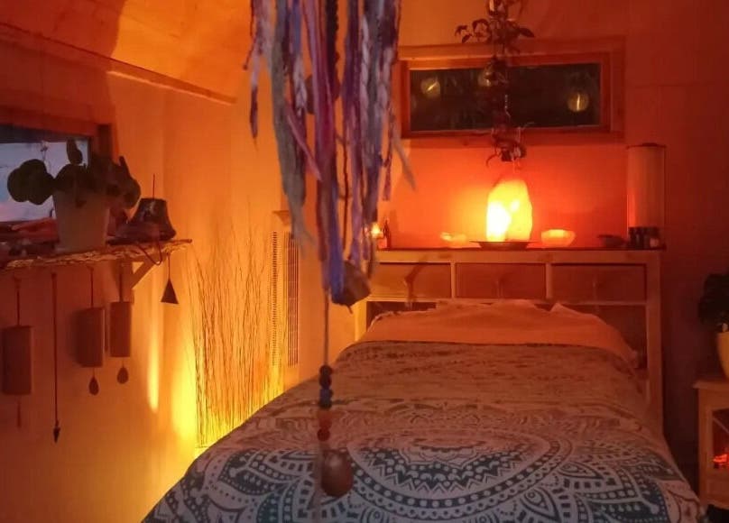 Relaxing therapy room at Hayle Cornish Holistic Therapies, Hayle, GB with warm lighting and serene decor.