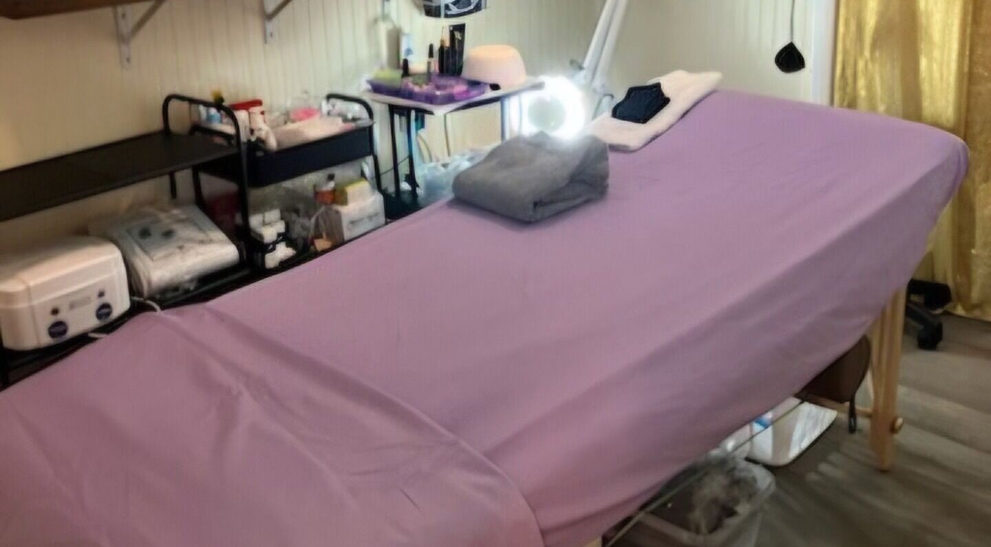 Tranquil massage room at Spa Life Sanctuary in Philadelphia, Pennsylvania, US, featuring a luxuriously prepared table.