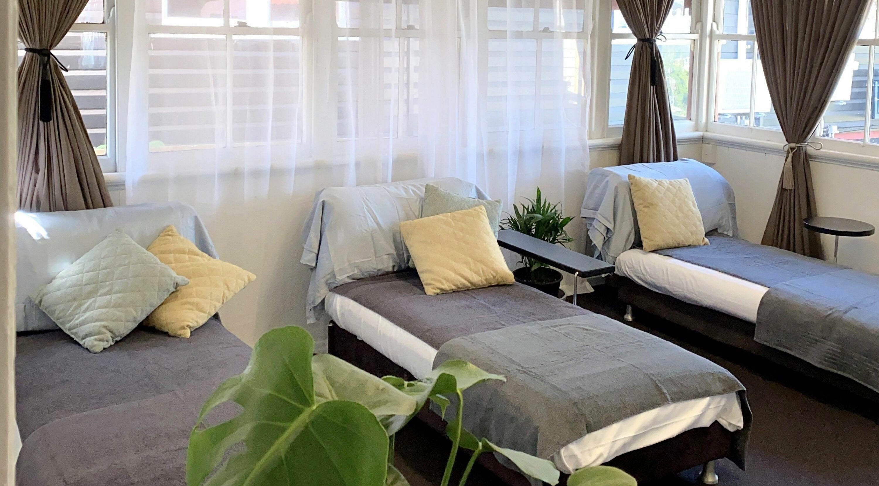 Relaxing massage space at Tranquility Remedial Thai Massage | Paddington, Queensland, AU, with cozy beds and soft lighting.