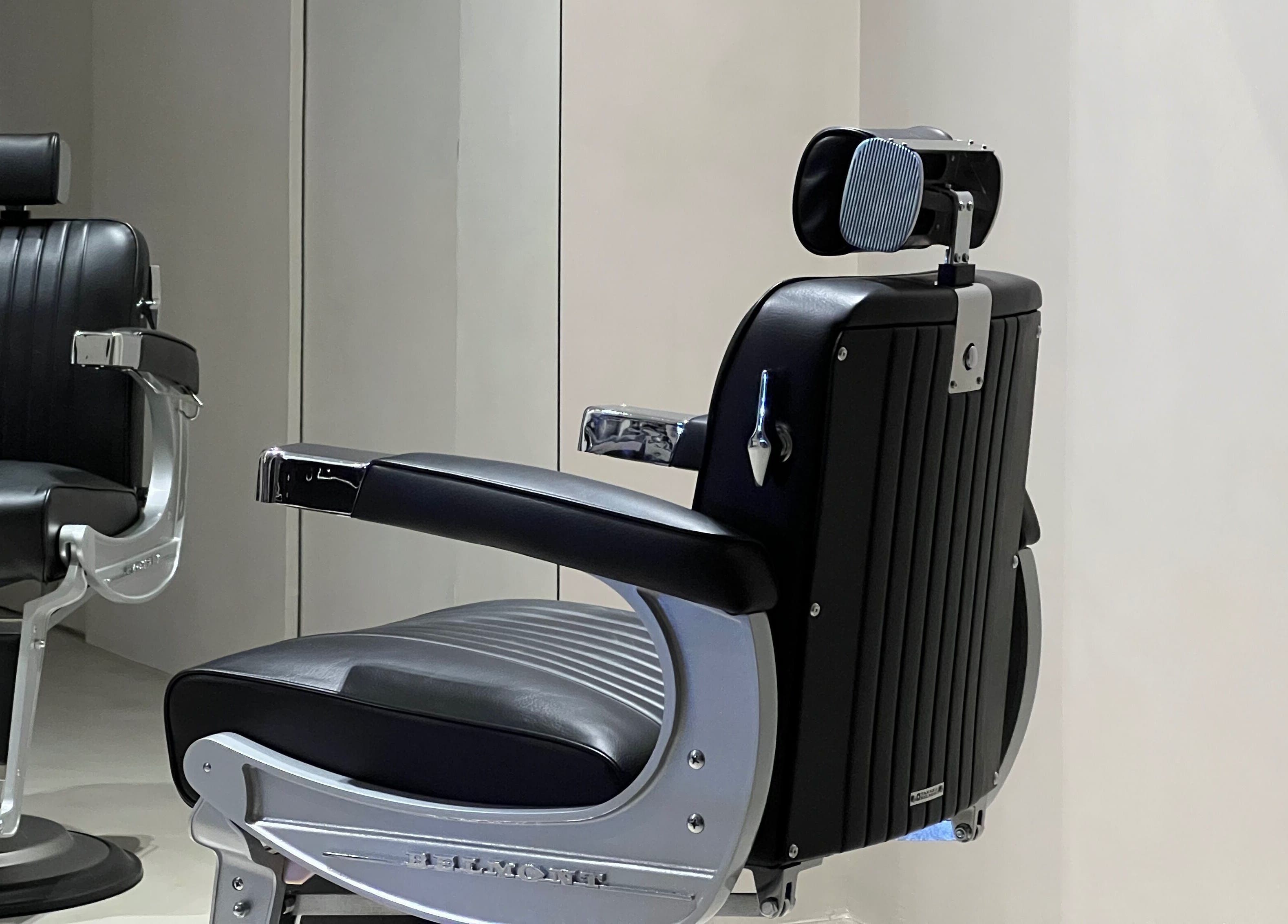 Modern black salon chair at Twig, Sharjah, Sharjah, AE, offering top-notch styling comfort.