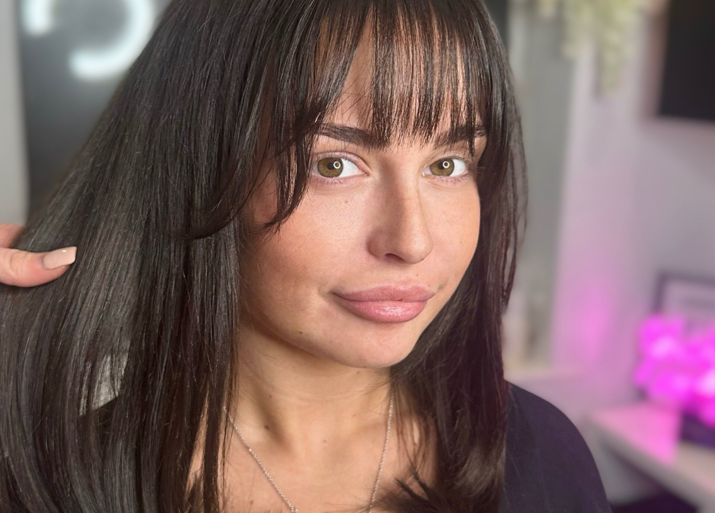 Close-up of a woman's styled hair at The Hair Club, Waterlooville, England, GB.
