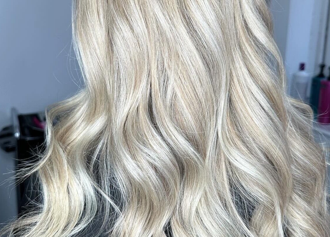Blonde wavy hair styled at The Hair Club, Waterlooville, England, GB, showcasing salon's expertise.