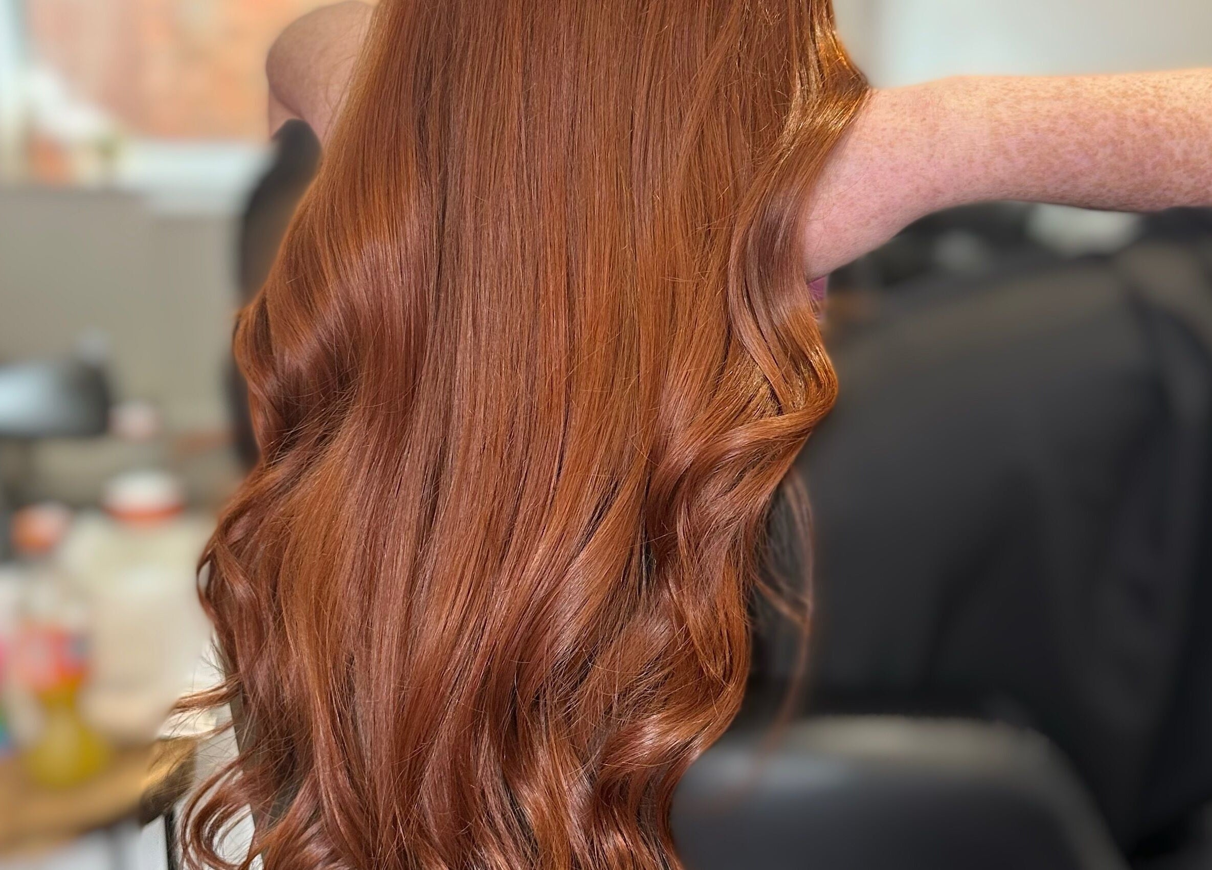 Luxurious red hair with soft waves at The Hair Club, Waterlooville, England, GB. Perfect salon styling.