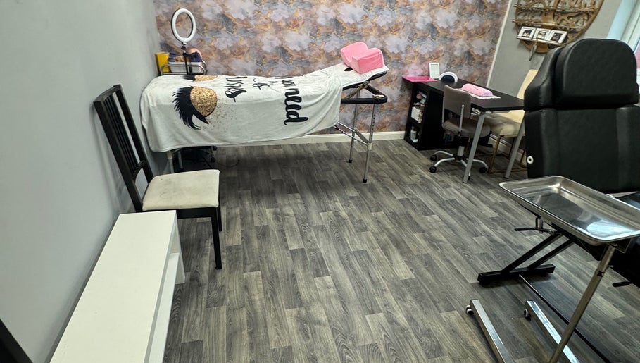 Cozy treatment room at Lavish Beauty & Aesthetics, Castleford, England, GB, featuring a massage table and stylish decor.