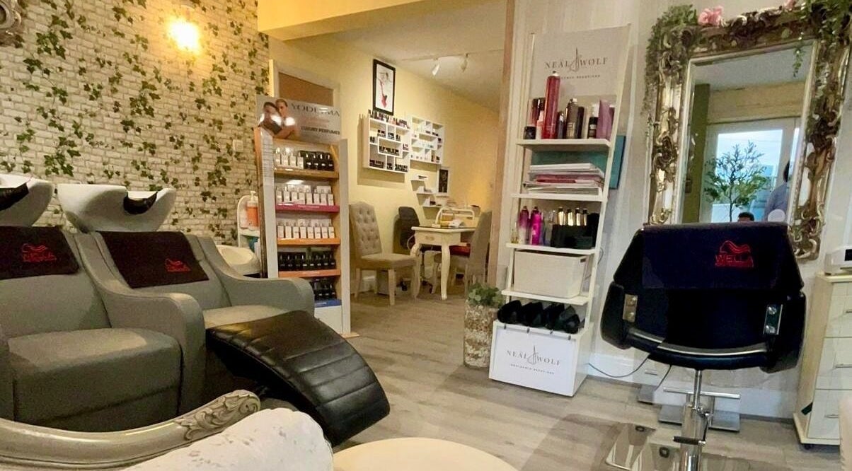 Interior of Dona’s Hair & Beauty Spa in Pontefract, England, GB featuring stylish salon chairs and products.