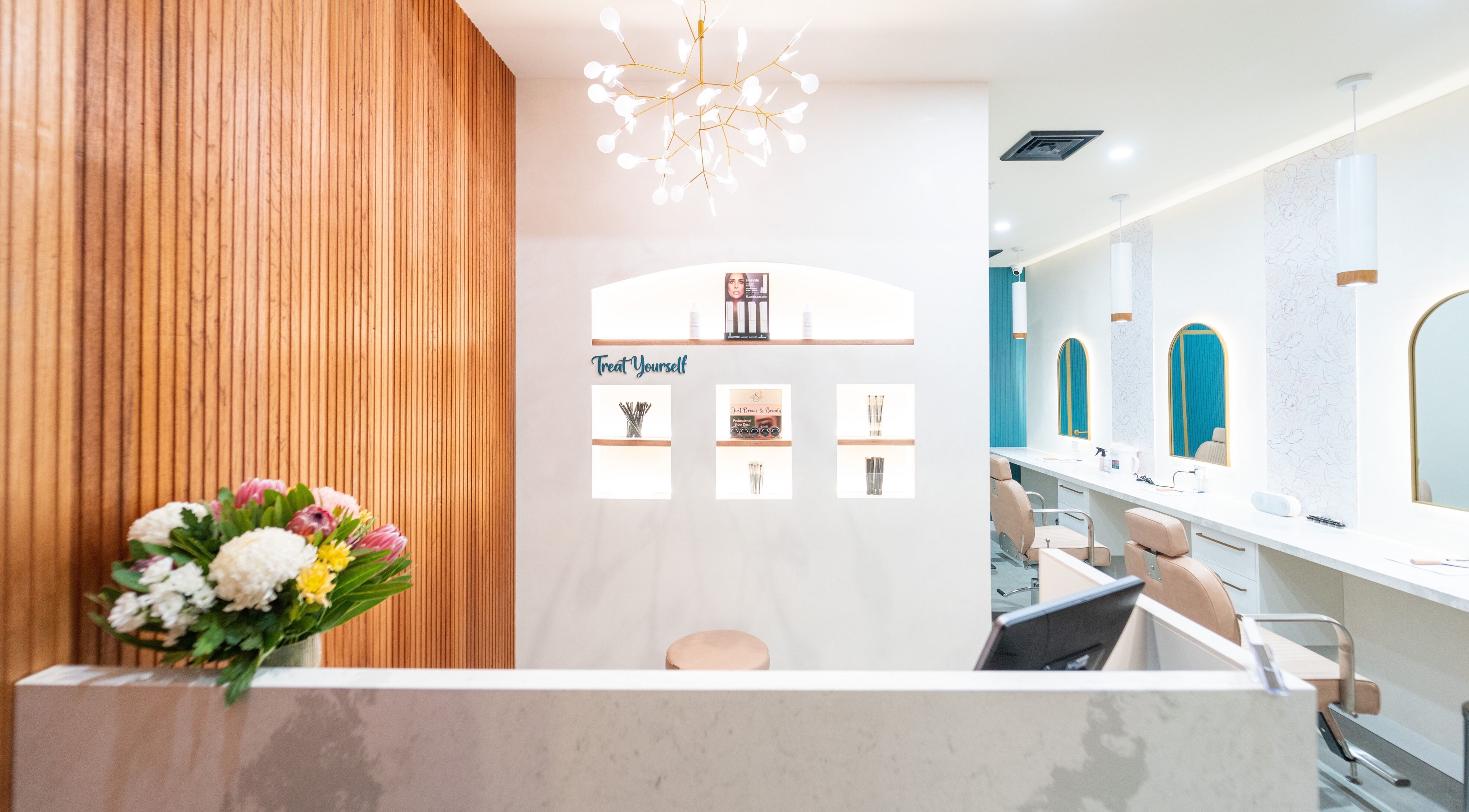 Elegant salon interior at Just Brows & Beauty, Adelaide, South Australia, AU, featuring stylish decor and seating.